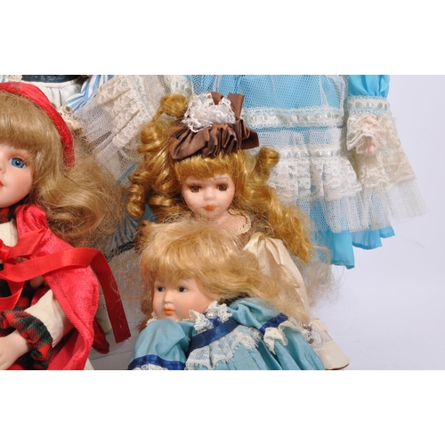 274 - A collection of assorted vintage porcelain headed dolls. Firmly stuffed cloth body with porcelain he... 