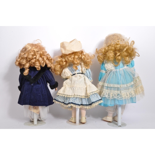 274 - A collection of assorted vintage porcelain headed dolls. Firmly stuffed cloth body with porcelain he... 