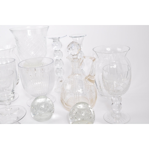 81 - A collection of 20th century cut glass to include vases, bubble control candle holders, bobbin turn ... 