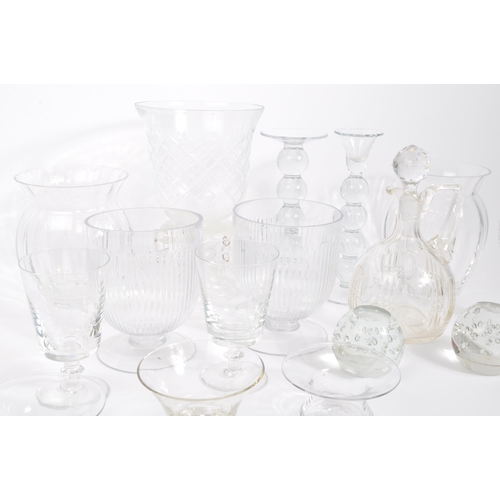 81 - A collection of 20th century cut glass to include vases, bubble control candle holders, bobbin turn ... 