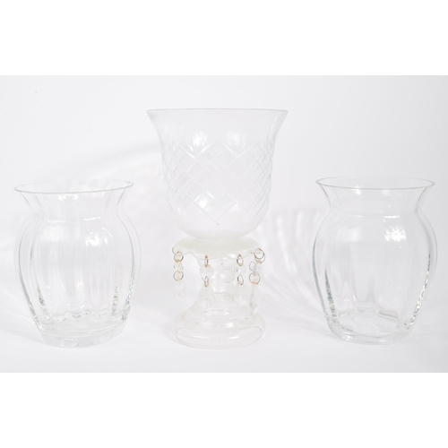 81 - A collection of 20th century cut glass to include vases, bubble control candle holders, bobbin turn ... 