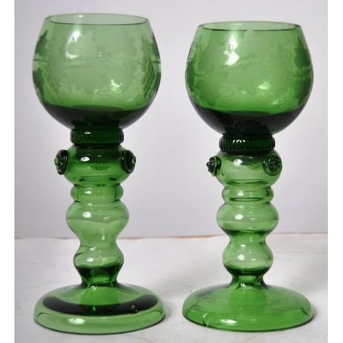 86 - A set of six 19th Century green glass drinking wine goblets glasses having etched leaf and vine deco... 