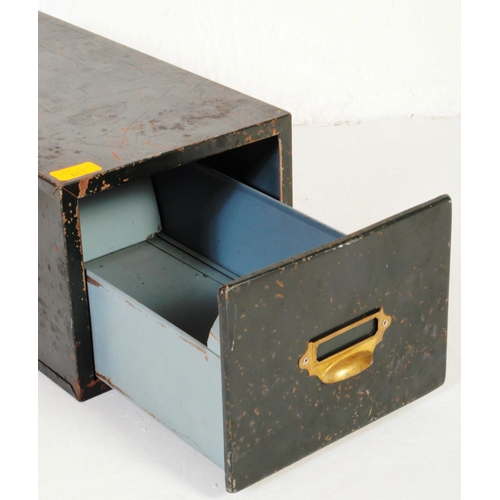 An early 20th century green table top filing in dark green