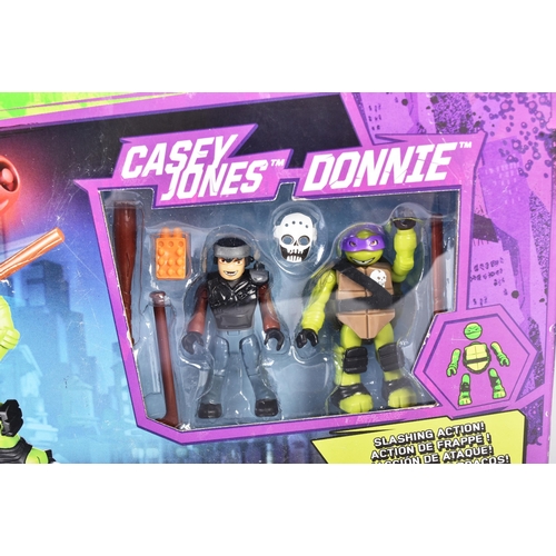 529 - Two Lego style ' Mega Bloks ' building block playsets Donnie Turtle Racer with Casey Jones and Donni... 