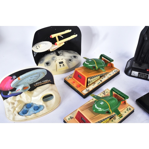 572 - A collection of retro novelty digital radio alarm clocks to include; Star Wars Darth Vader, Anakins ... 