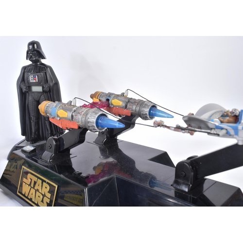 572 - A collection of retro novelty digital radio alarm clocks to include; Star Wars Darth Vader, Anakins ... 