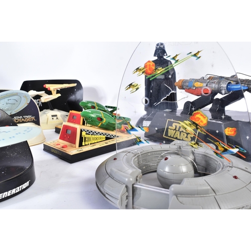572 - A collection of retro novelty digital radio alarm clocks to include; Star Wars Darth Vader, Anakins ... 