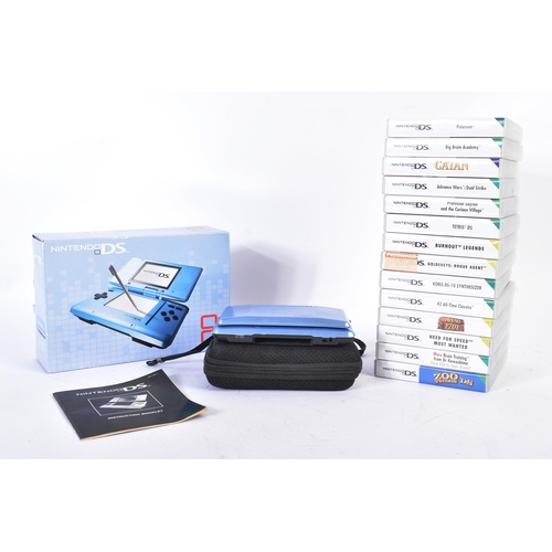 593 - Retro Gaming - a boxed Nintendo DS hand held video game console with a selection of games to include... 