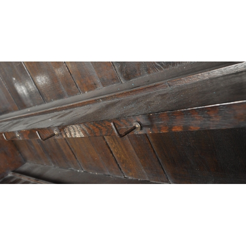 19 - An 18th century George III oak Welsh dresser. Raised on bracket feet supporting a wide body of three... 