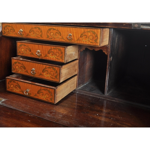 24 - An 18th century walnut and marquetry inlaid bureau bookcase. The bureau with stunning floral and swa... 