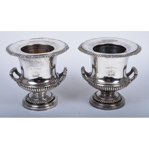 25 - A pair of 19th century Old Sheffield silver plated wine coolers in the form of urns. Each with centr... 