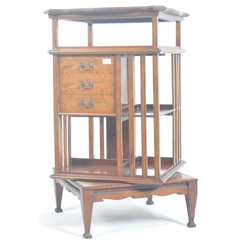3 - An Edwardian mahogany and marquetry inlaid revolving pedestal bookcase. Raised on square tapering le... 
