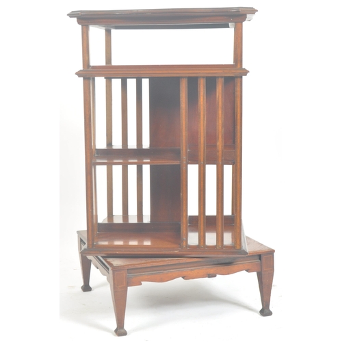 3 - An Edwardian mahogany and marquetry inlaid revolving pedestal bookcase. Raised on square tapering le... 