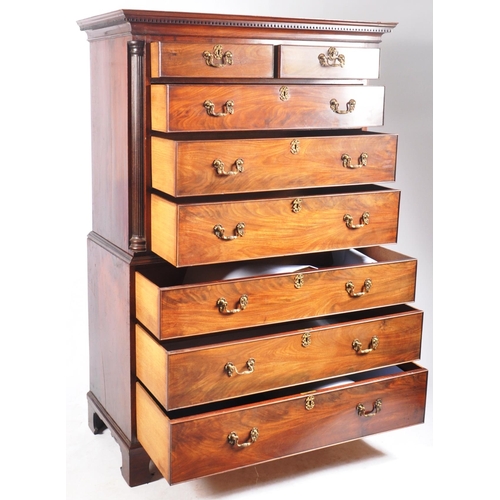 33 - An 18th Century George III mahogany chest on chest of drawers - tallboy. The flared edge pediment to... 