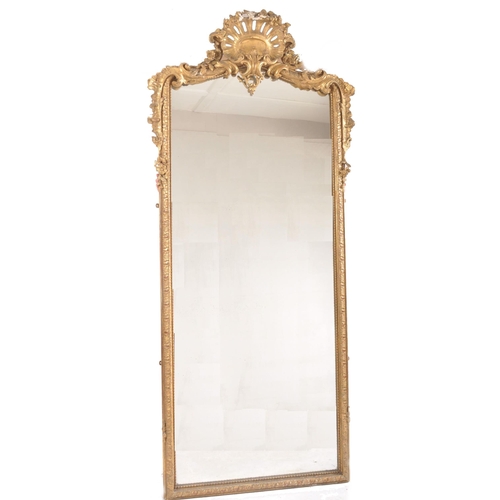 36 - A large 19th Century giltwood and gesso worked tall wall mirror. Gilt wood and gesso worked frame wi... 