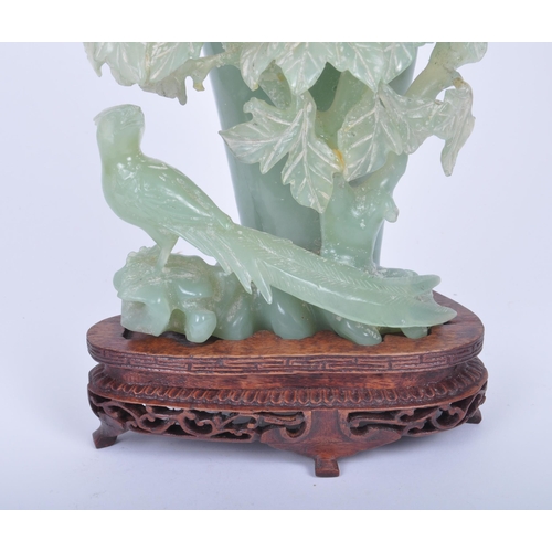 45 - A 19th century Chinese carved jade lidded urn / vase in the form of a peony / rose bush, with blosso... 