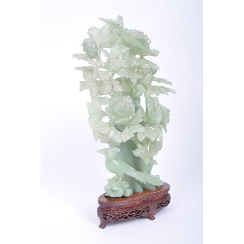 45 - A 19th century Chinese carved jade lidded urn / vase in the form of a peony / rose bush, with blosso... 