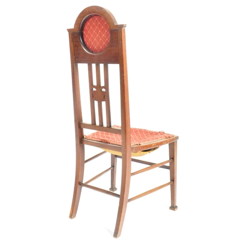 48 - An Edwardian mahogany inlaid investiture chair being raised on tapered legs with stretchers having t... 