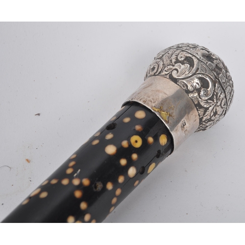 55 - A high Victorian walking stick / cane with silver top, floral repousse decorated, on mahogany stick ... 