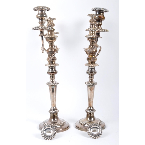 57 - A hallmarked silver pair of George III candelabra candlesticks. Hallmarked Sheffield, date letter fo... 