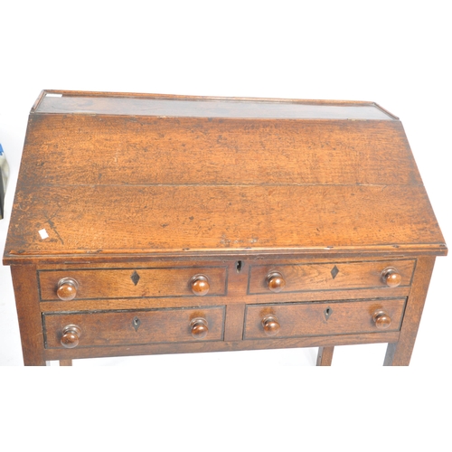 62 - An 18th century oak and elm wood clerks desk - bureau. Raised on squared legs with twin small drawer... 