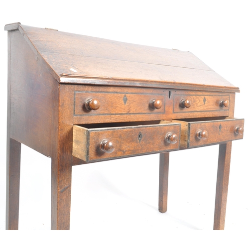 62 - An 18th century oak and elm wood clerks desk - bureau. Raised on squared legs with twin small drawer... 