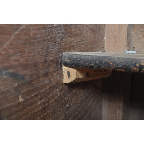 62 - An 18th century oak and elm wood clerks desk - bureau. Raised on squared legs with twin small drawer... 