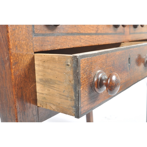 62 - An 18th century oak and elm wood clerks desk - bureau. Raised on squared legs with twin small drawer... 