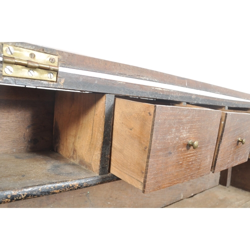 62 - An 18th century oak and elm wood clerks desk - bureau. Raised on squared legs with twin small drawer... 