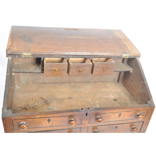 62 - An 18th century oak and elm wood clerks desk - bureau. Raised on squared legs with twin small drawer... 