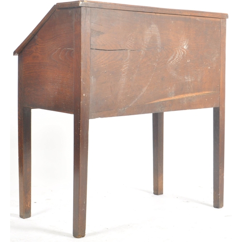 62 - An 18th century oak and elm wood clerks desk - bureau. Raised on squared legs with twin small drawer... 