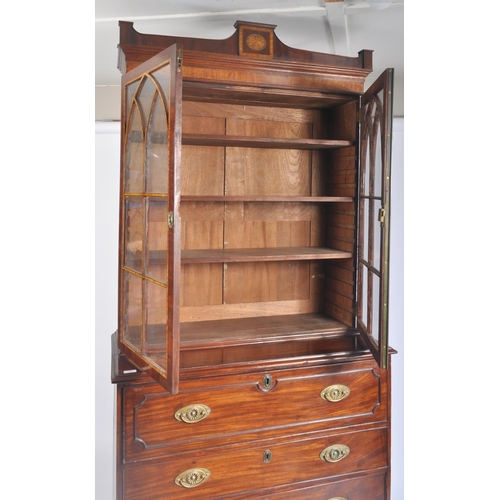 65 - A high Victorian early 20th century flame mahogany secretaire bookcase having an inlaid glazed top w... 