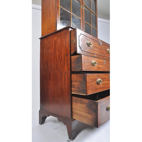 65 - A high Victorian early 20th century flame mahogany secretaire bookcase having an inlaid glazed top w... 