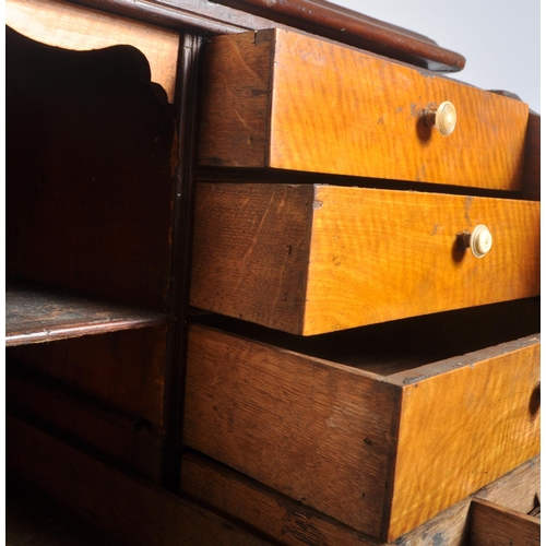 65 - A high Victorian early 20th century flame mahogany secretaire bookcase having an inlaid glazed top w... 