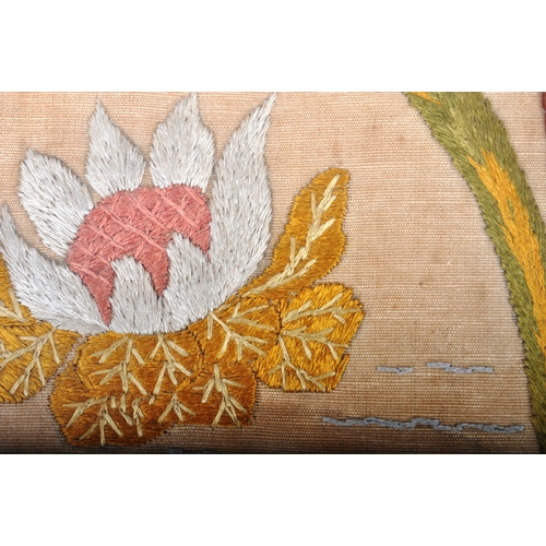 16 - An early 20th Century tapestry embroidery panel depicting butterflied and blossoming flowers on beig... 