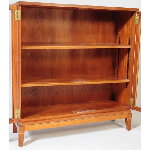 552 - British Modern Design - A mid century teak wood library bookcase cabinet. Raised on squared legs wit... 