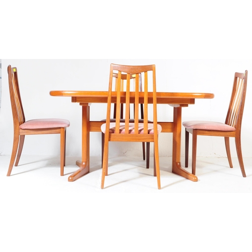 554A - A retro, 20th Century 1970's teak dining table and four chairs by G-Plan. The table of large oval fo... 