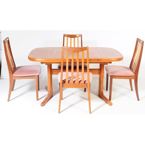 554A - A retro, 20th Century 1970's teak dining table and four chairs by G-Plan. The table of large oval fo... 