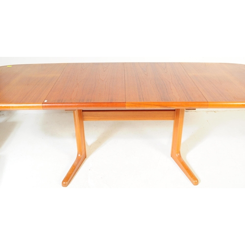 554A - A retro, 20th Century 1970's teak dining table and four chairs by G-Plan. The table of large oval fo... 