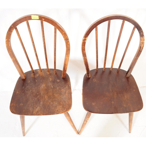 571a - A pair of retro vintage mid 20th century Ercol beech and elm dining chairs having hoop back with spi... 