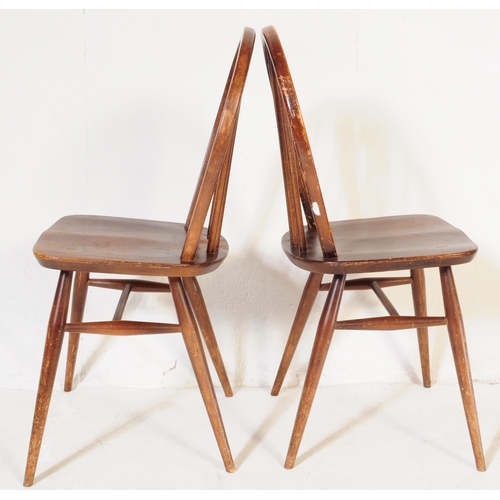 571a - A pair of retro vintage mid 20th century Ercol beech and elm dining chairs having hoop back with spi... 