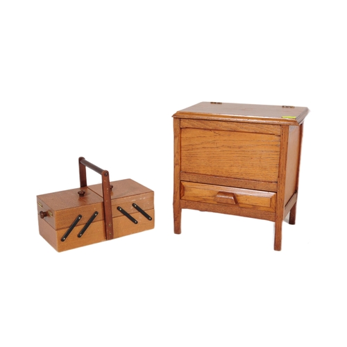 572a - An early 20th century circa. 1920's sewing box alongside a retro mid 20th century circa. 1960's teak... 