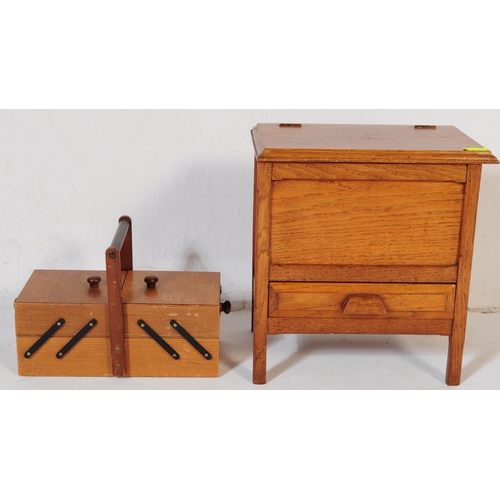 572a - An early 20th century circa. 1920's sewing box alongside a retro mid 20th century circa. 1960's teak... 