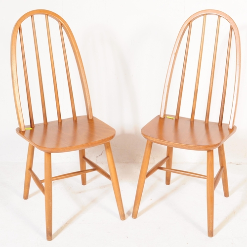 600 - A pair of retro vintage, mid 20th Century beech, high back Windsor style chairs, in the manner ofÂ L... 