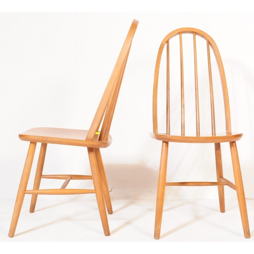 600 - A pair of retro vintage, mid 20th Century beech, high back Windsor style chairs, in the manner ofÂ L... 