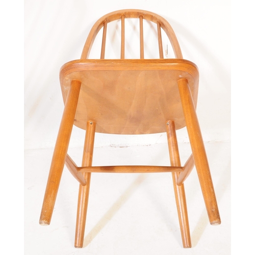 600 - A pair of retro vintage, mid 20th Century beech, high back Windsor style chairs, in the manner ofÂ L... 