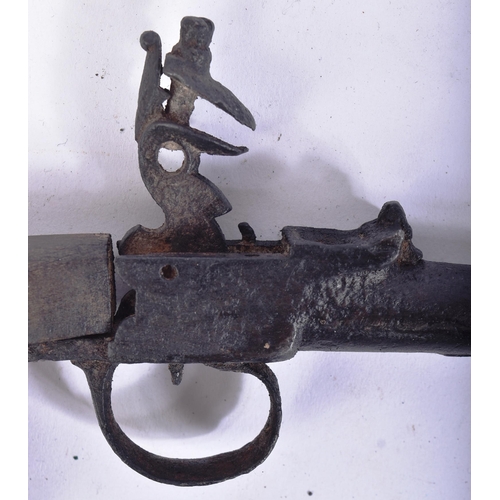 104 - A 19th Century European flintlock pistol. Hooked wooden stock and cannon shaped barrel. Flintlock me... 