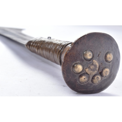 139 - Two early 20th Century Central African / Congolese tribal daggers. Both with wooden hilts and copper... 