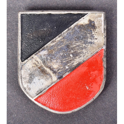 166 - A WWII Second World War Third Reich Nazi German Luftwaffe tropical helmet insignia. Tri coloured shi... 