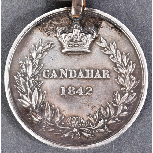 18 - A 19th Century First Anglo-Afghan War medal for Candahar. The obverse shows the head of Queen Victor... 